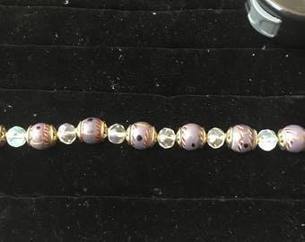 Beaded purple and gold bracelet