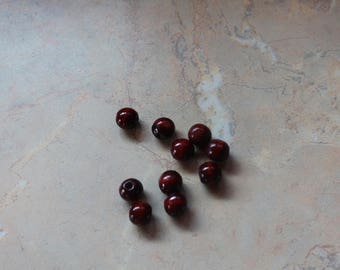 Wooden, round beads, dark color. 10mm