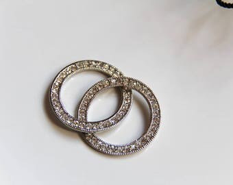 The pendant double interlocking circles silver and rhinestone