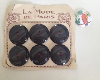 Old plate of 6 black buttons