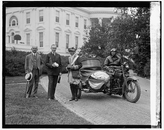 President Coolidge, sidecar motorcycle, in front of White House, 1924