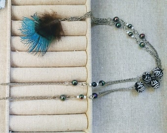 Long necklace with feather paon50% was 20.99