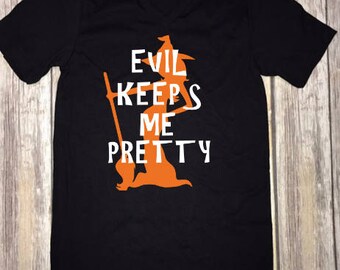 Evil Keeps Me Pretty Cute Halloween T-Shirt/Cool Halloween Shirts/Halloween Shirts For Women/Witch T-Shirts/Girls Halloween T-Shirt