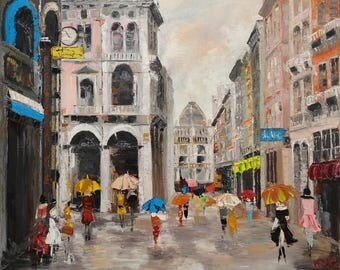A rainy day in the city. Colored umbrellas