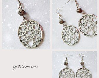 Earrings with silver color bead.
