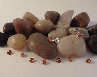 Orange rhinestone studs