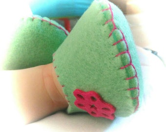 Green water in thick felt baby booties.