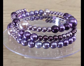 Bracelet triple strand glass bead memory.