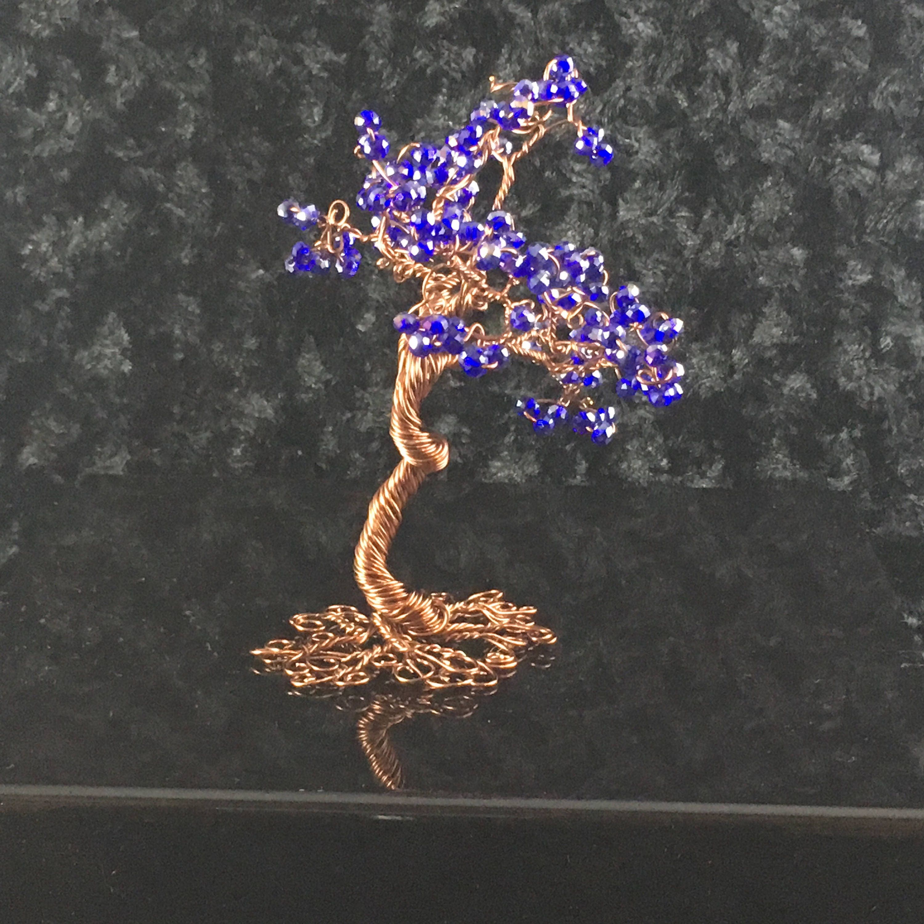 Copper Wire Bonsai Tree with blue glass beads dancing in the