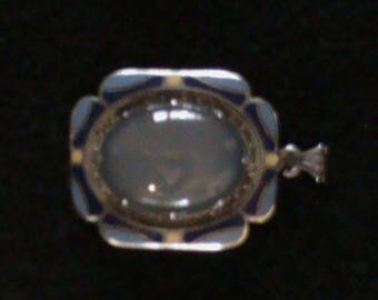 Blue enamel with cloudy stone pendant with silver border