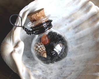 Nature tiny glass vial necklace with black salt, carnelian crystal and tiny seashell.